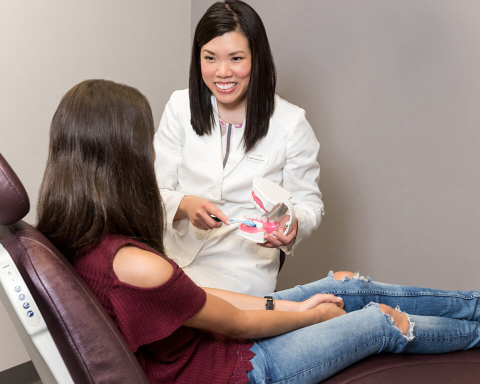 Dr Chen Seeing a Patient in McKinney TX Dentist | About the Dentist