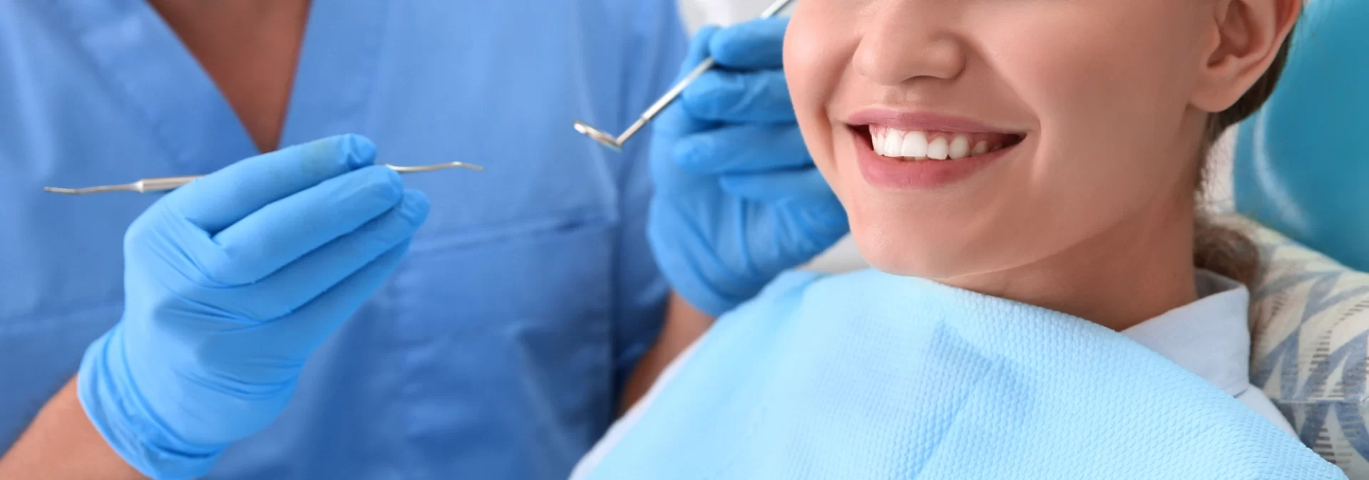 close up of the lower half of a woman's smiling face of dentist in McKinney TX | Dental Crowns