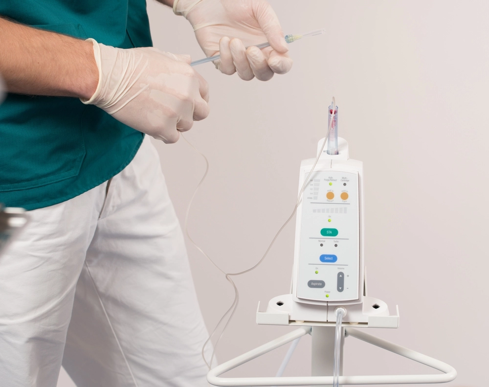 dentist with IV pump machine